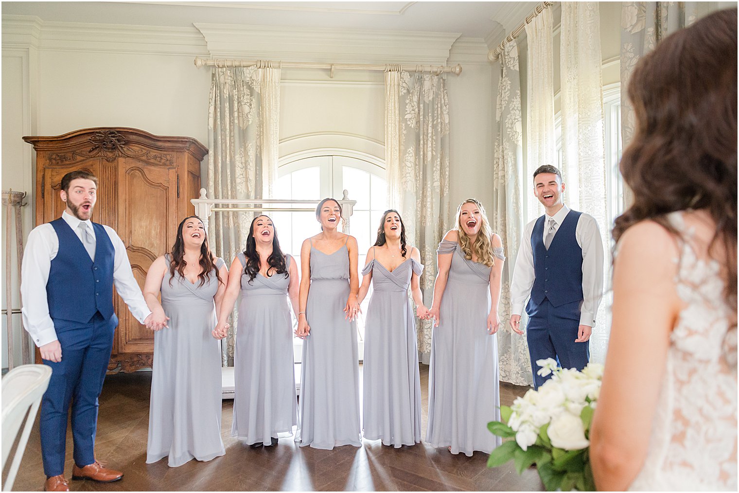 bridal party reacts to bride's look at Park Chateau Estate and Gardens