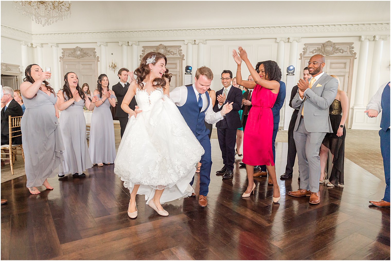 bride dances with guests during East Brunswick, NJ wedding reception 