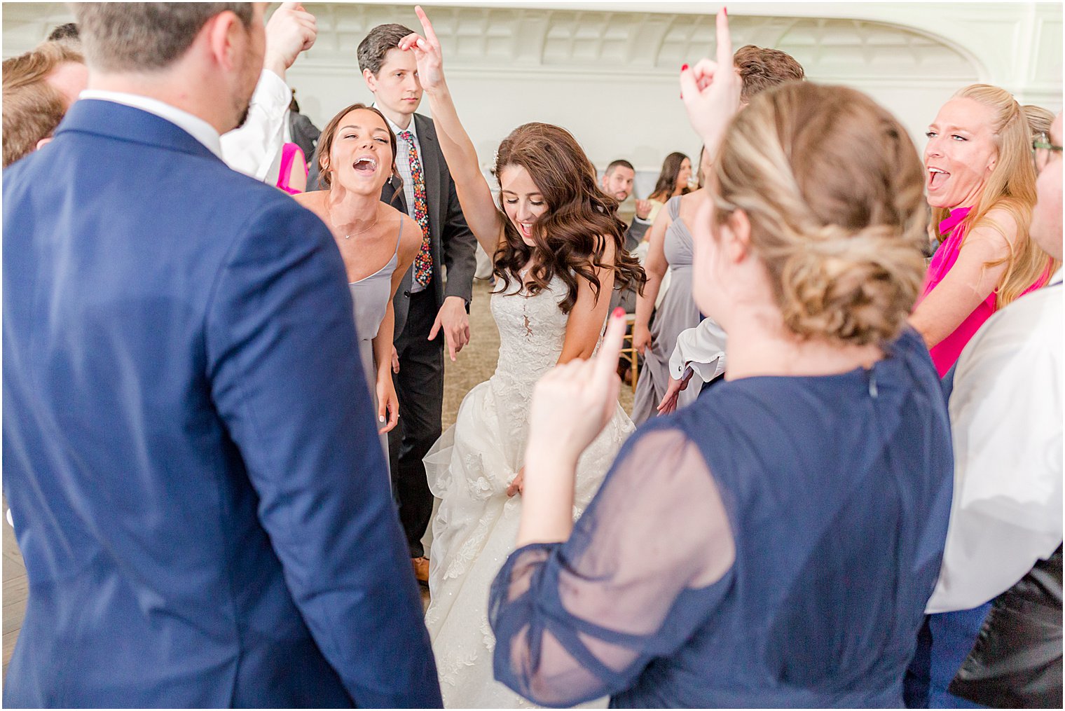 bride dances with guests at East Brunswick, NJ wedding reception 