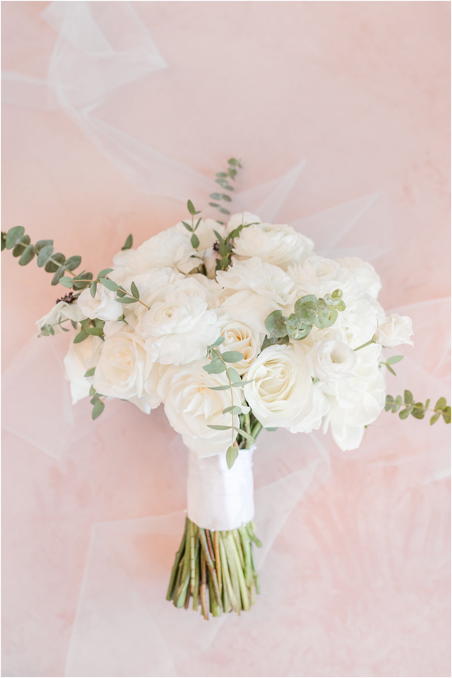 all-white bouquet with roses and eucalyptus 
