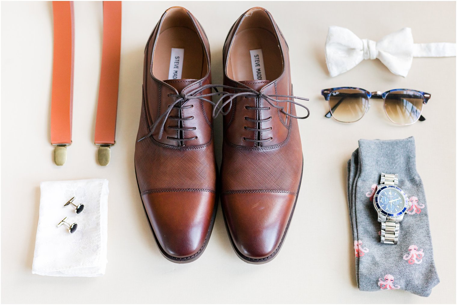groom's brown shoes, suspenders, white bowtie and details for NJ wedding day 