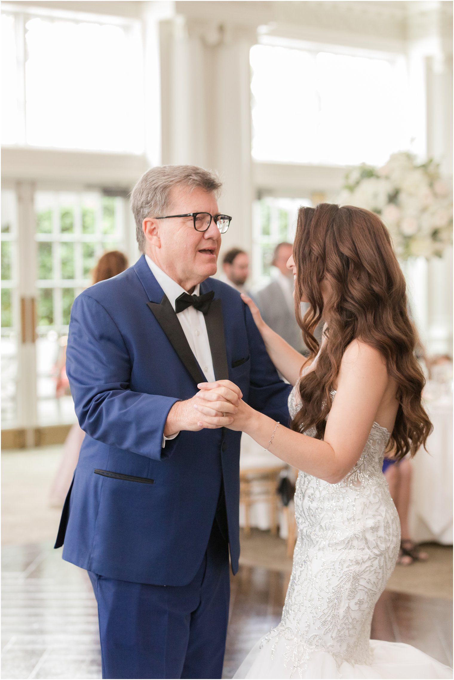 bride dance with dad in navy and black suit jacket at Park Chateau Estate wedding reception 