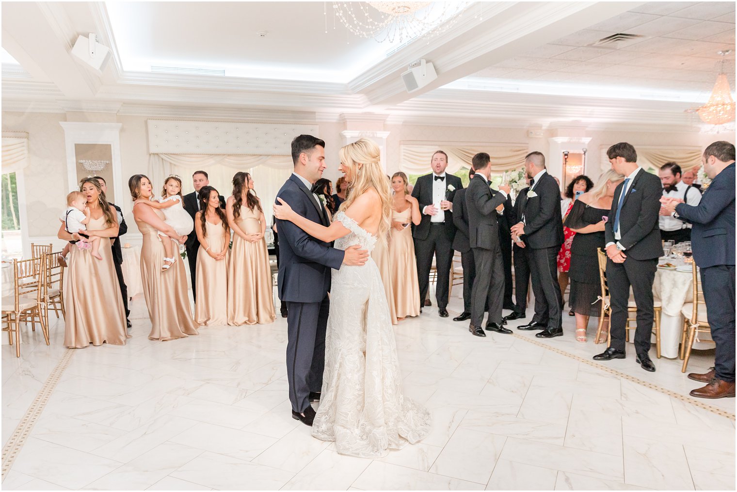 bride and groom have first dance in ballroom at The English Manor 