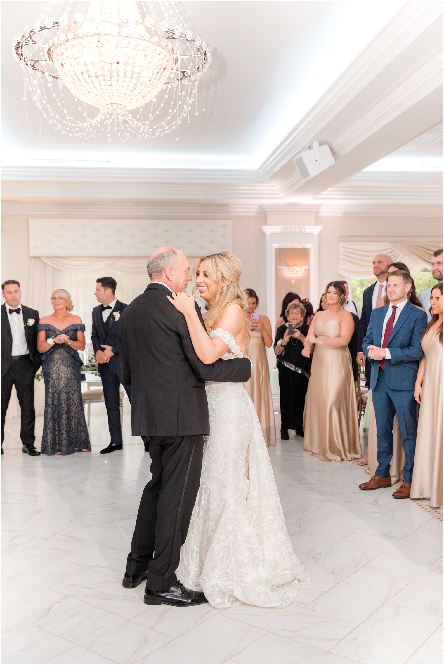 bride smiles dancing with dad during ballroom wedding reception at The English Manor 