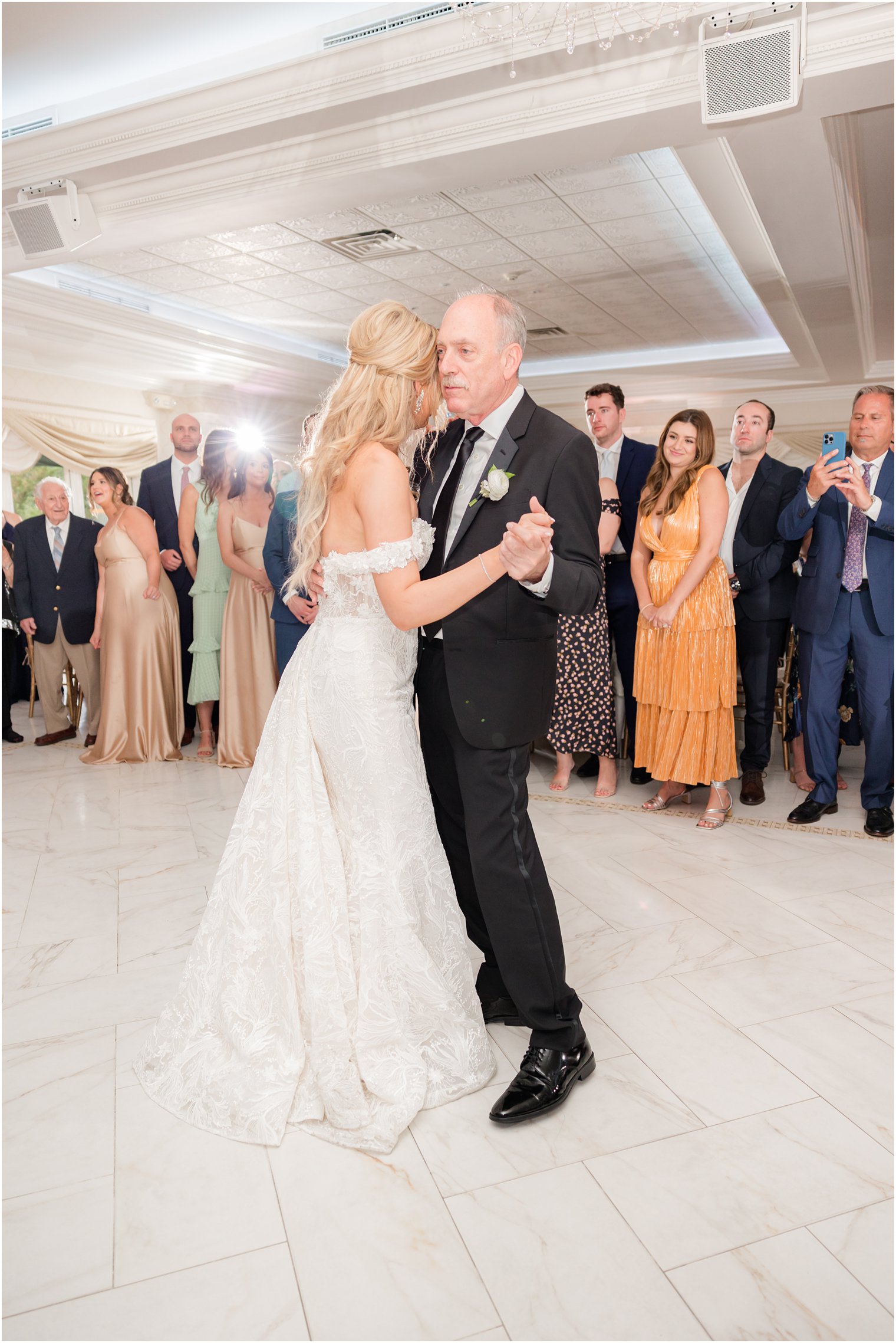 bride hugs dad dancing with him during Ocean Nj wedding reception 