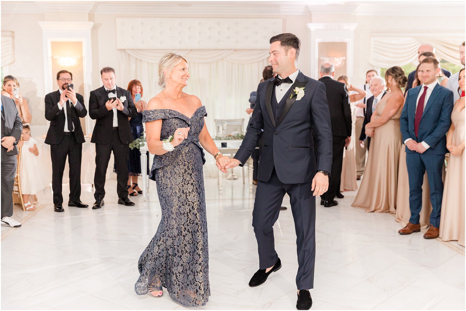 groom leads mom to dance floor in New Jersey ballroom