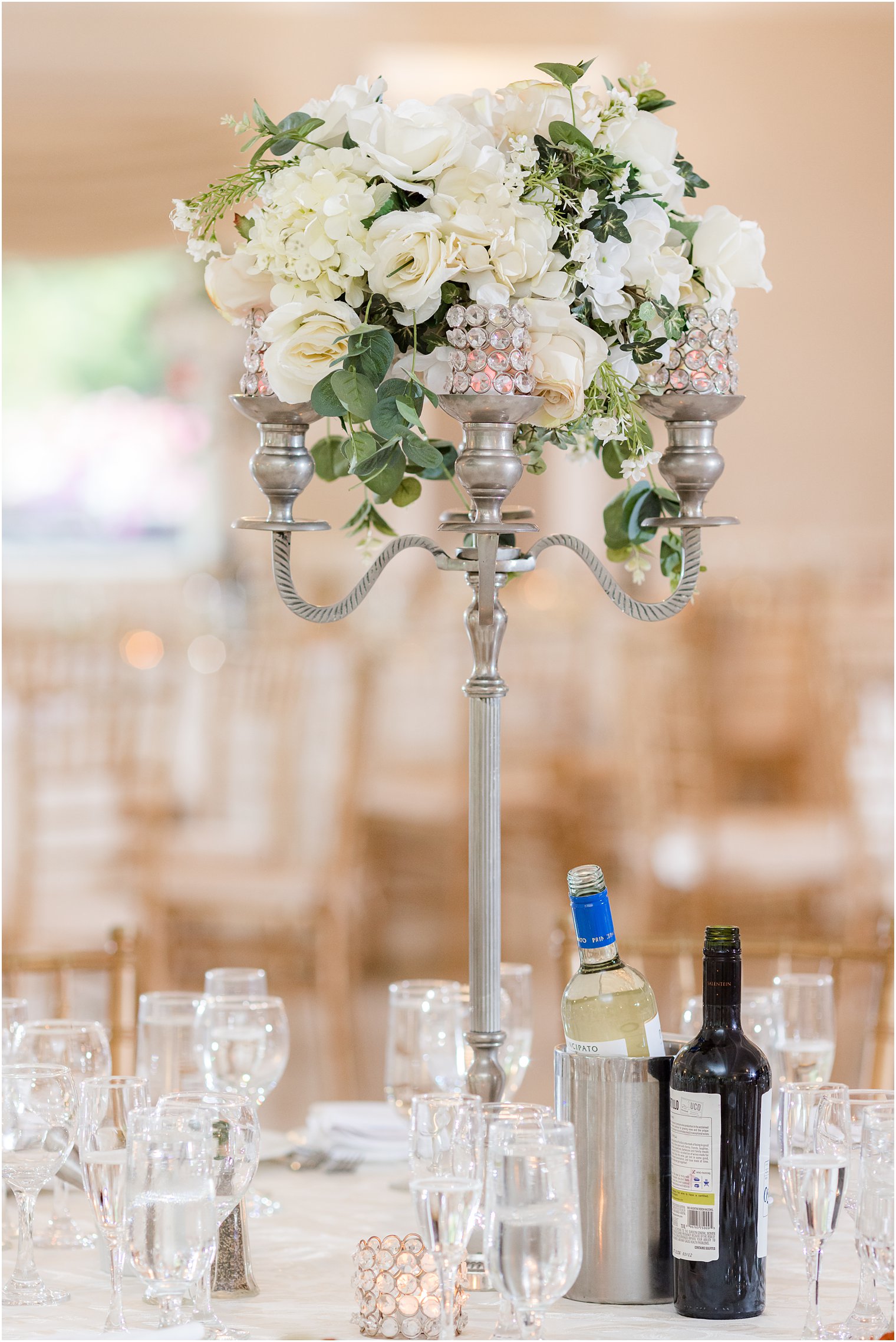 floral centerpiece with white roses and glass details for garden style wedding at The English Manor