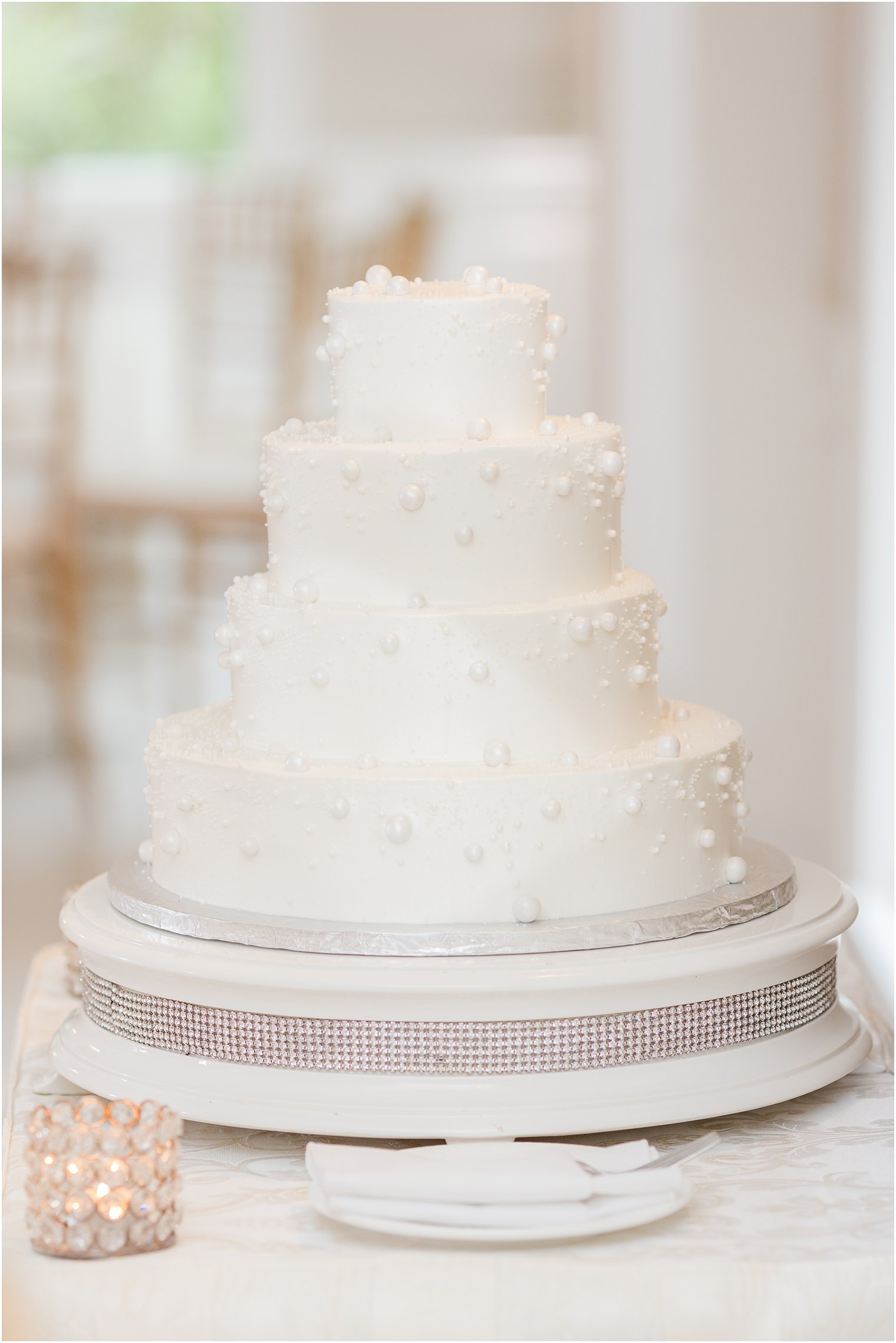 tiered wedding cake with petal details at The English Manor