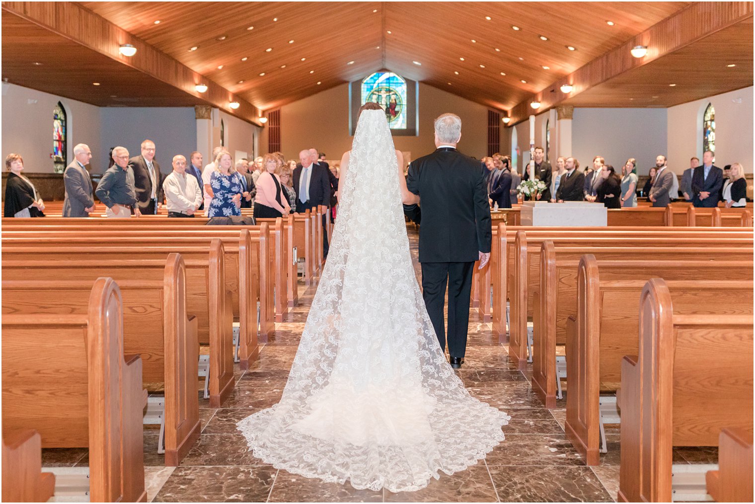 bride walks down aisle with dad for traditional church ceremony in small New Jersey church