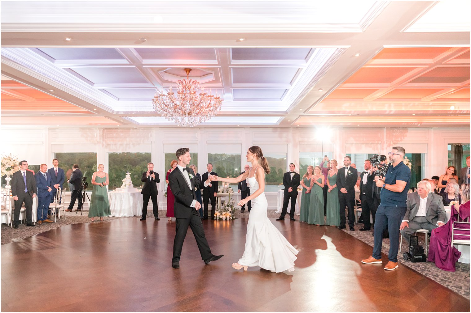 groom leads bride onto dance floor at NJ wedding reception 