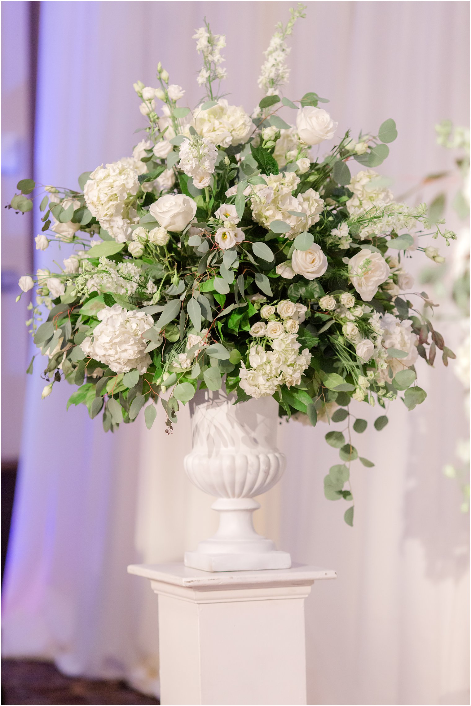 ivory rose floral display for ceremony at the Ballroom at the Ben