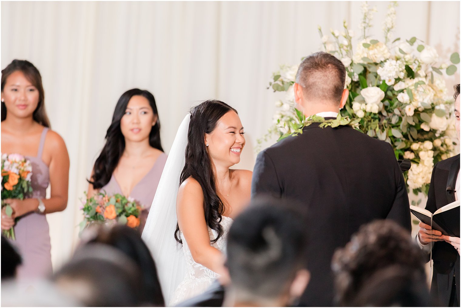 bride laughs during ceremony in Philadelphia PA hotel