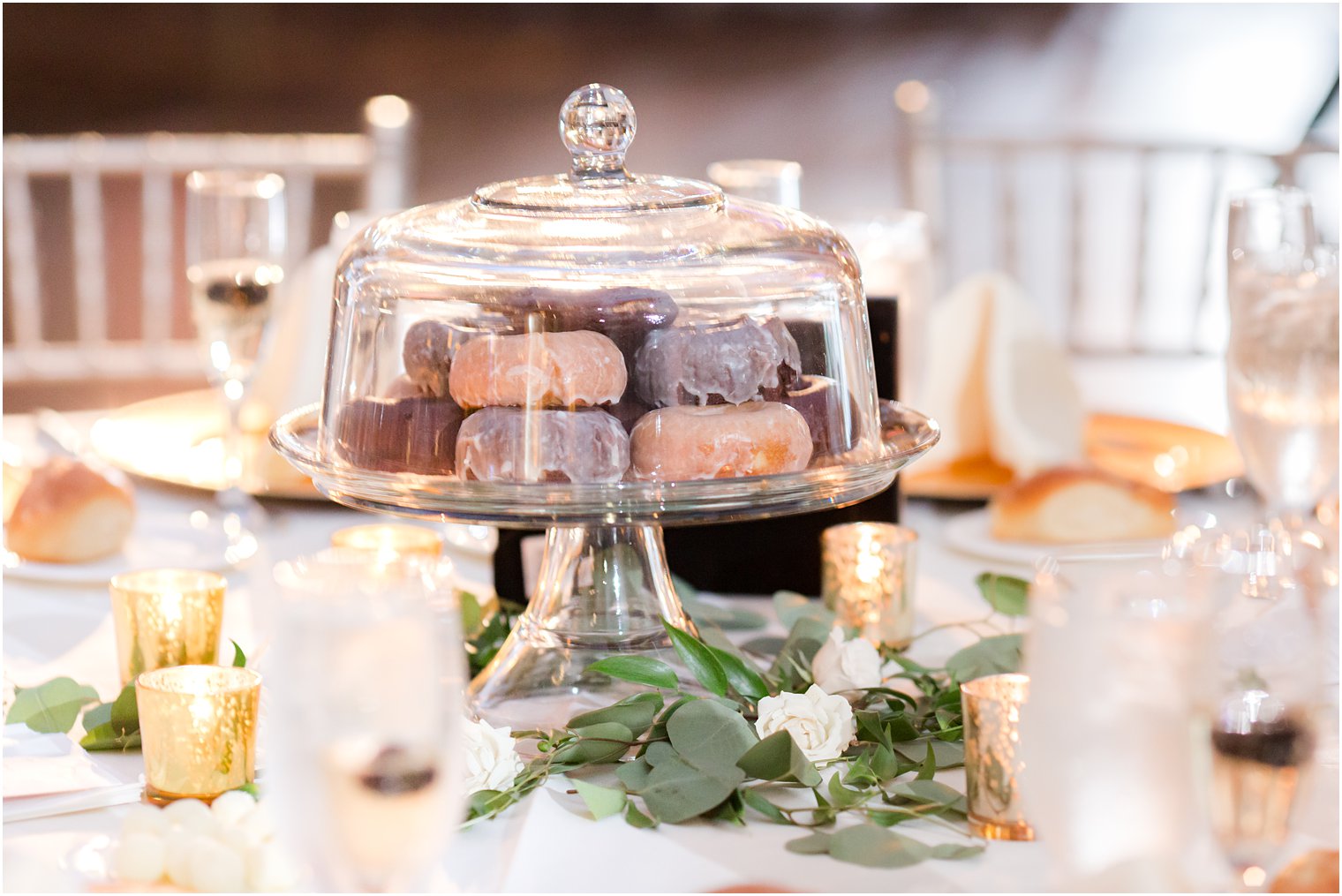 donuts in clear cake stand for centerpieces at Philly wedding 