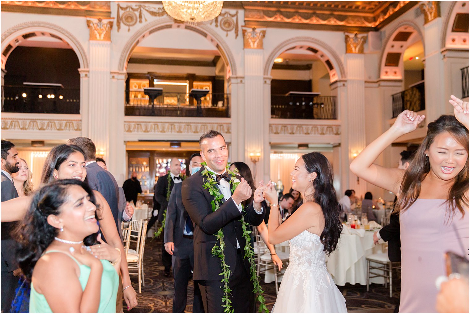 groom dances with bride during wedding reception at the Ballroom at the Ben