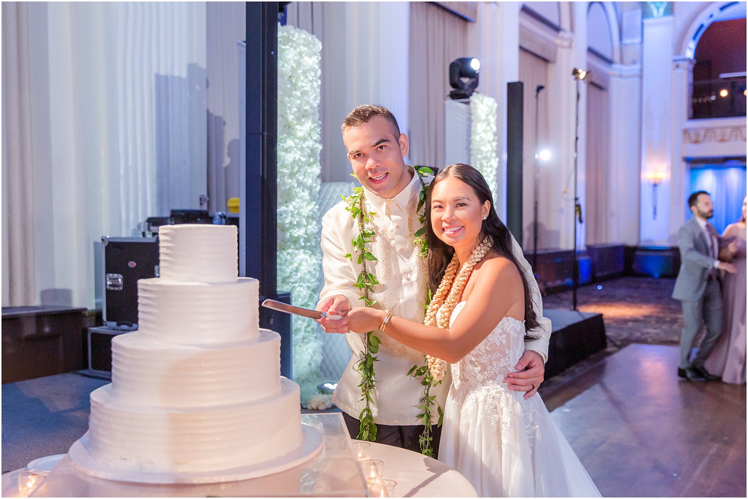 bride and groom cut wedding cake during Philly PA wedding reception 