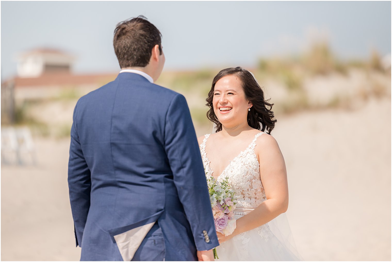 groom turns to see bride for first look on Avalon beach 