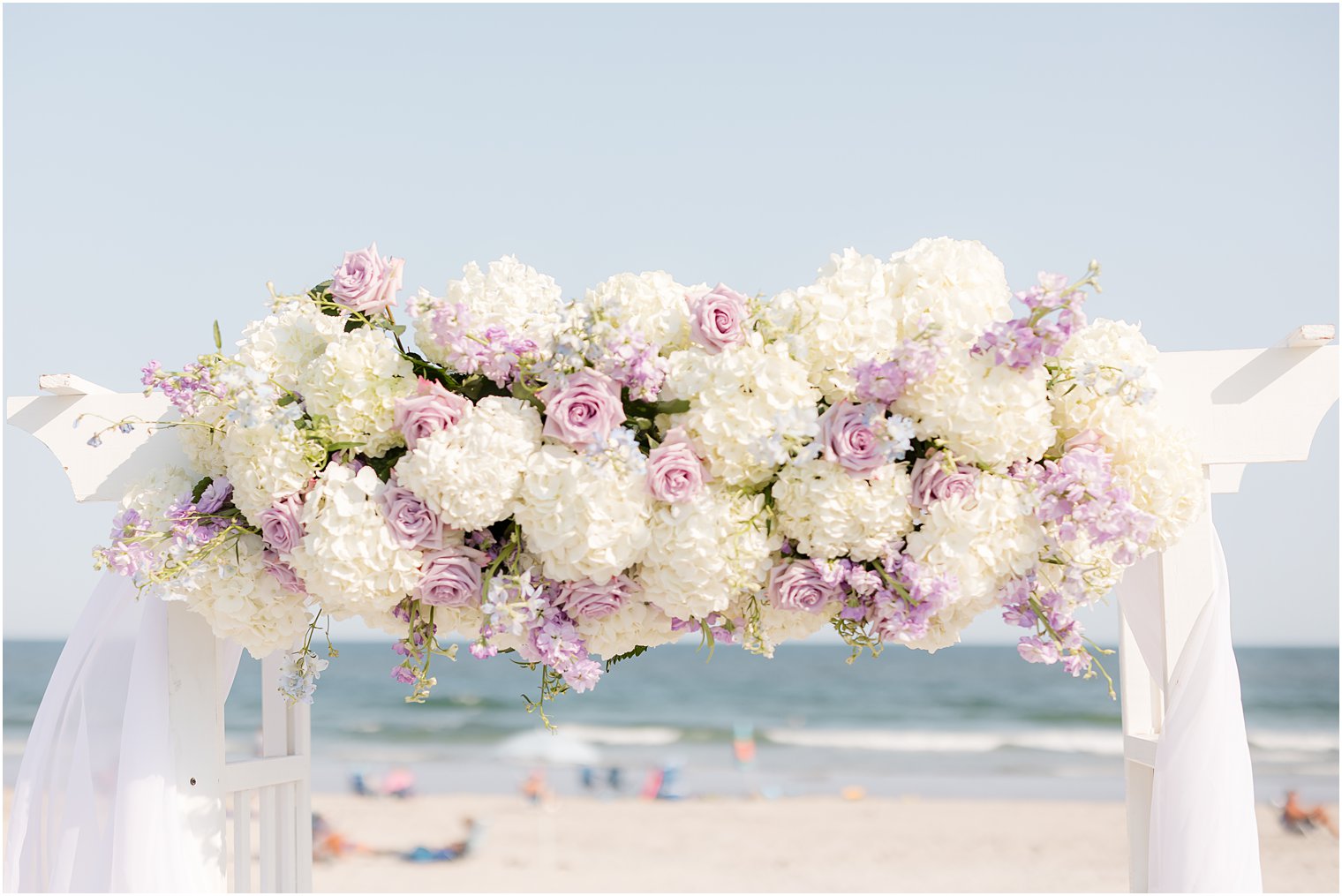 white and purple floral accents for arbor 