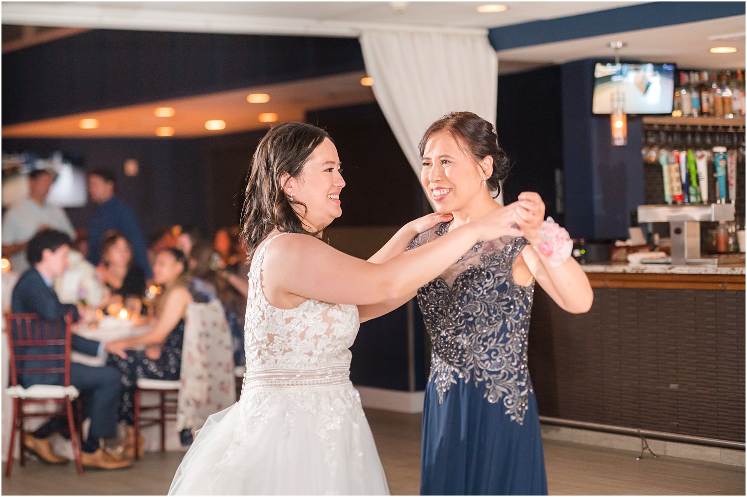 bride dances with mom during reception at Icona Winddrift