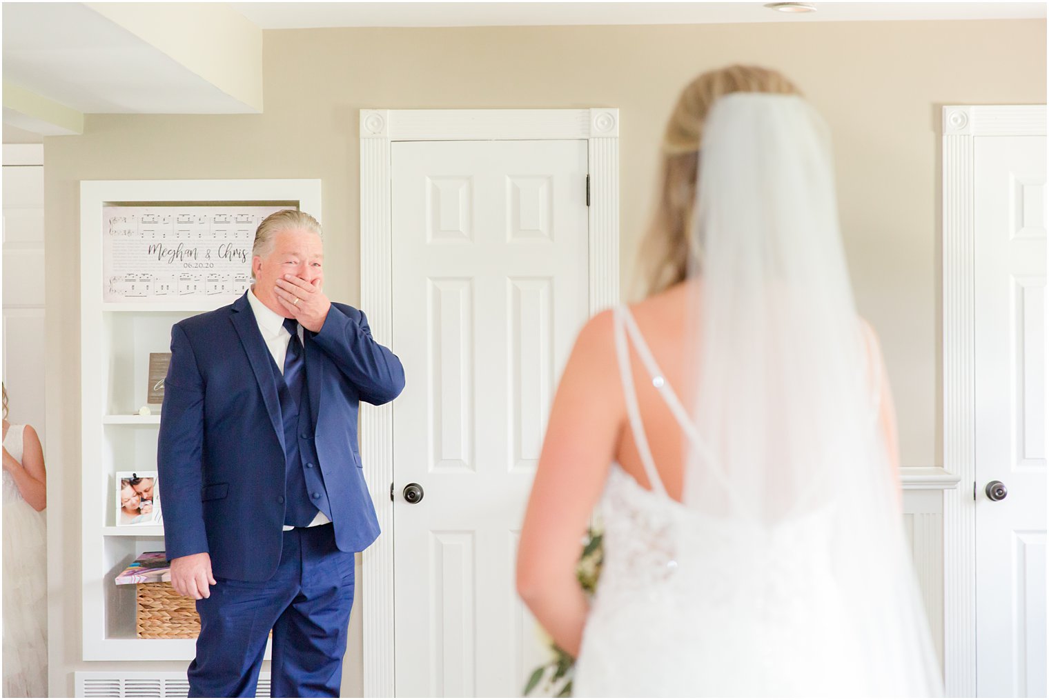 dad covers mouth in surprise during first look with bride 