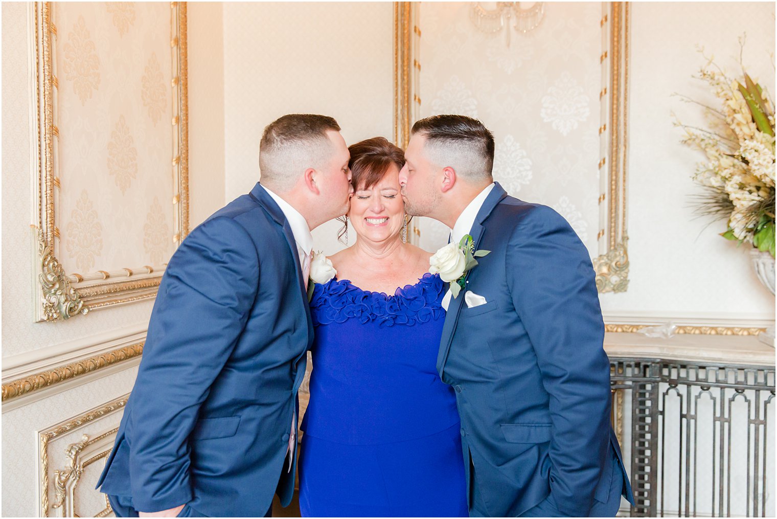 brothers kiss mom's cheek during photos at Brigalia's