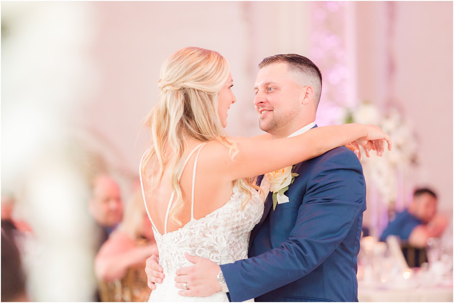 newlyweds smile hugging during first dance at Brigalia's