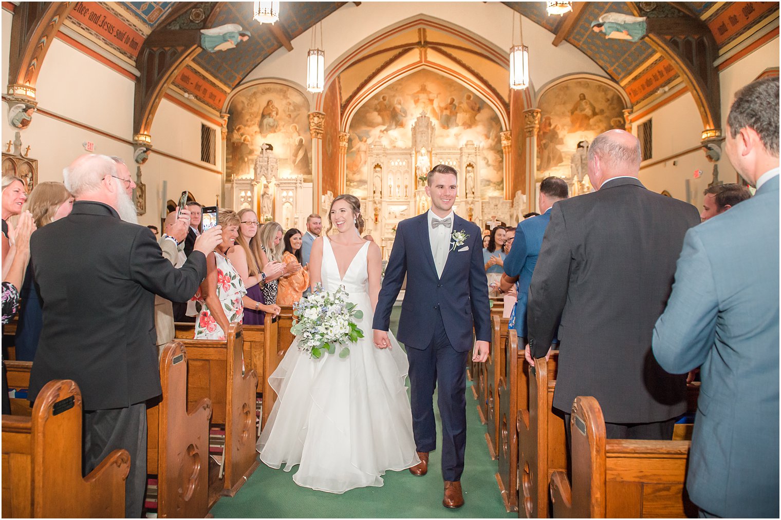 bride and groom leave traditional church wedding ceremony at St. Peter's Church