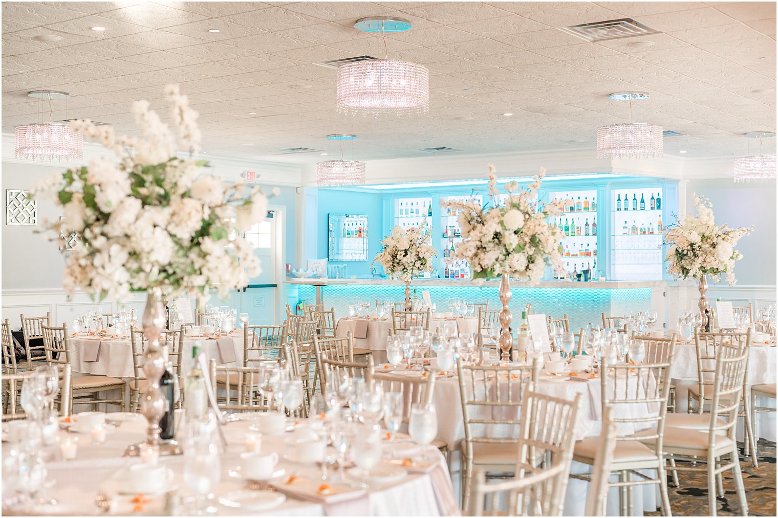 Crystal Point Yacht Club wedding reception with white flowers 