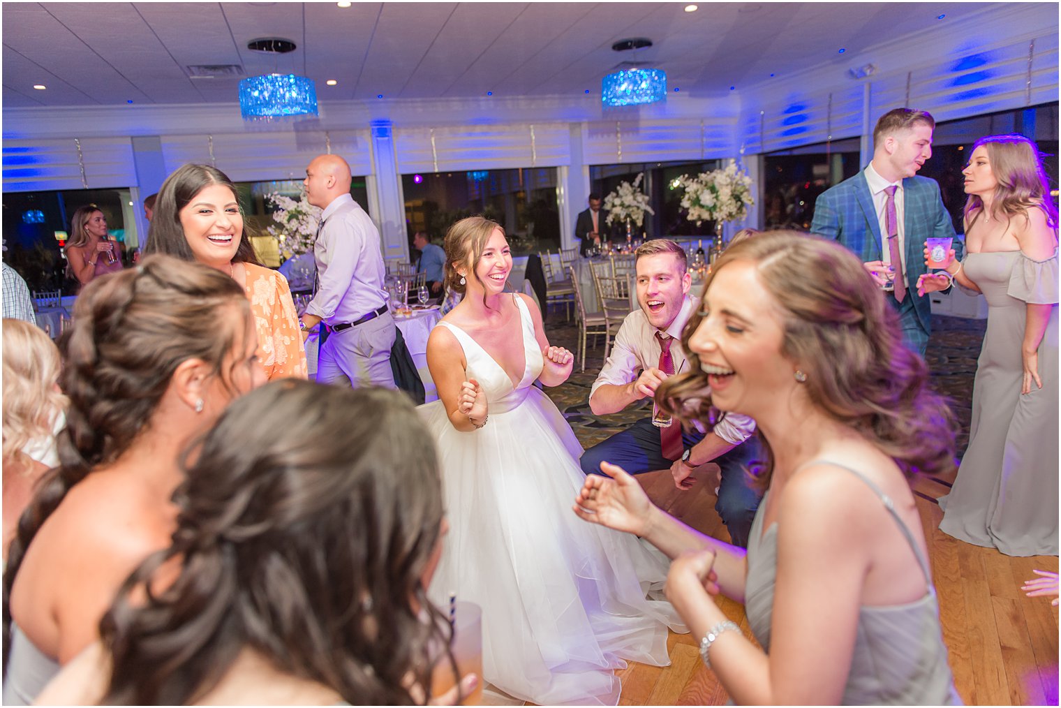 bride dances with bridesmaids during NJ wedding reception 