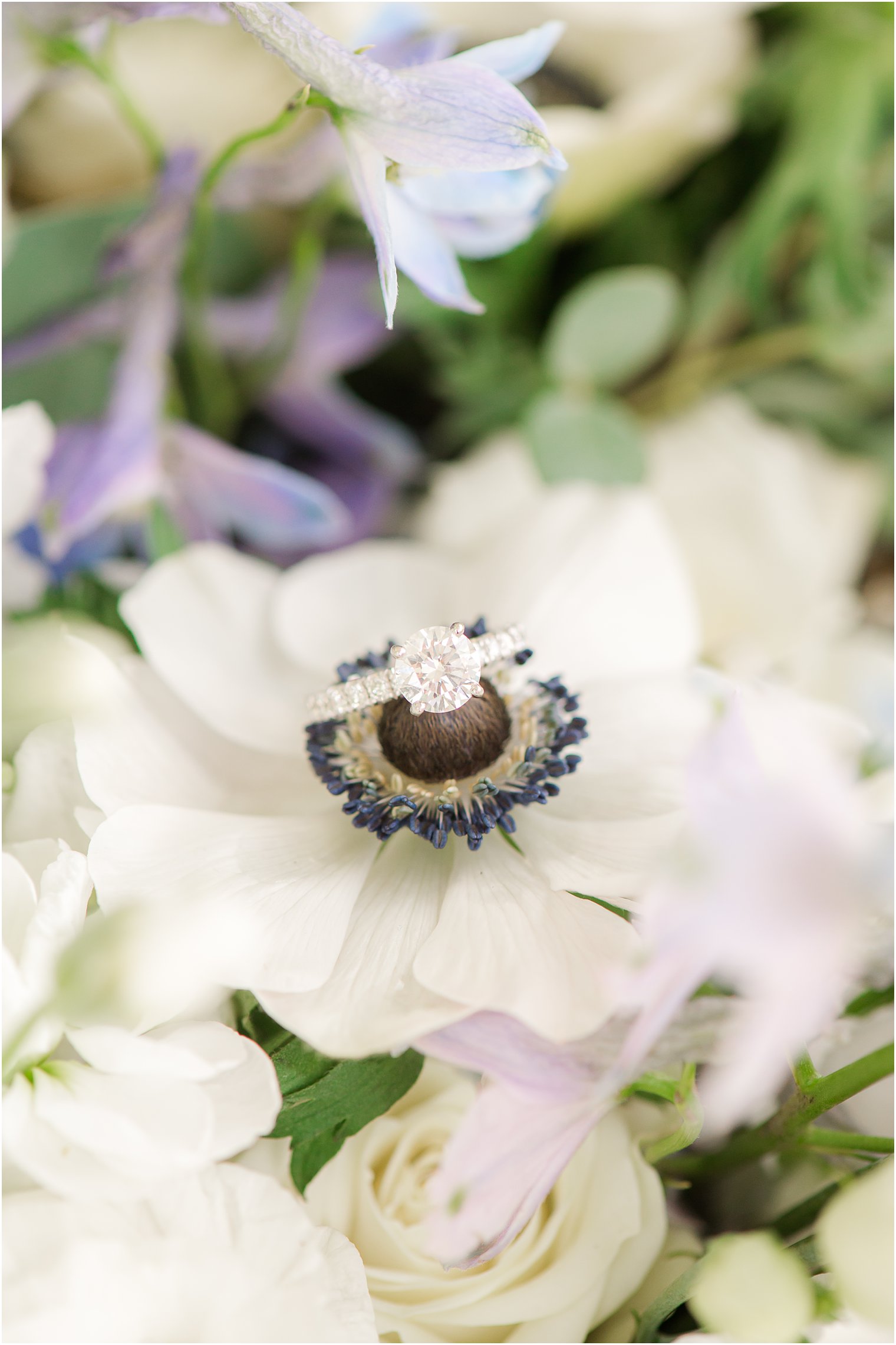 wedding ring rests on bouquet