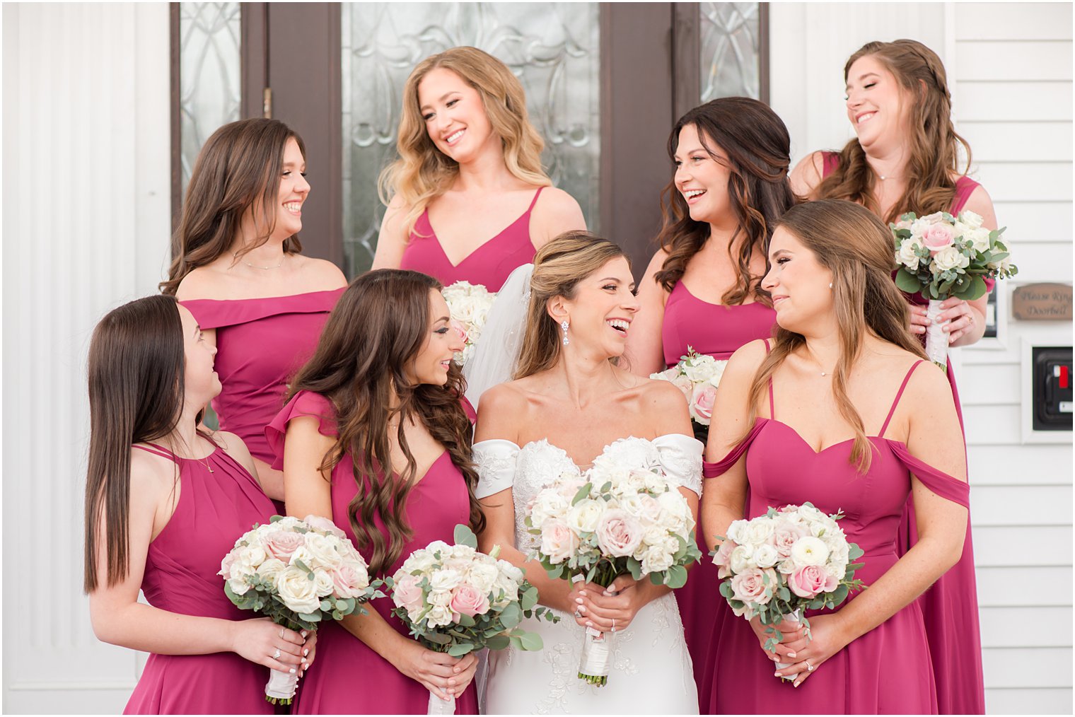 bride laughs with bridesmaids in pink gowns at Park Savoy Estate