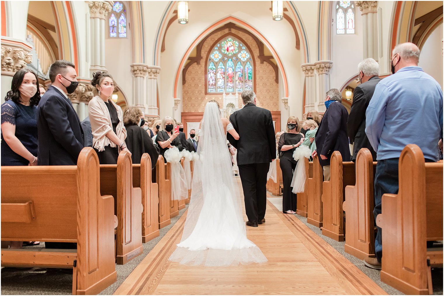 father walks bride down aisle at St. Vincent's Martyr Catholic Church