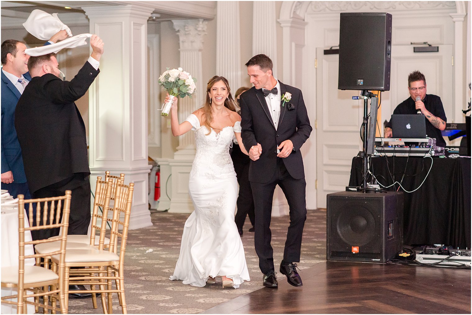 bride and groom dance into wedding reception in ballroom at Park Savoy Estate