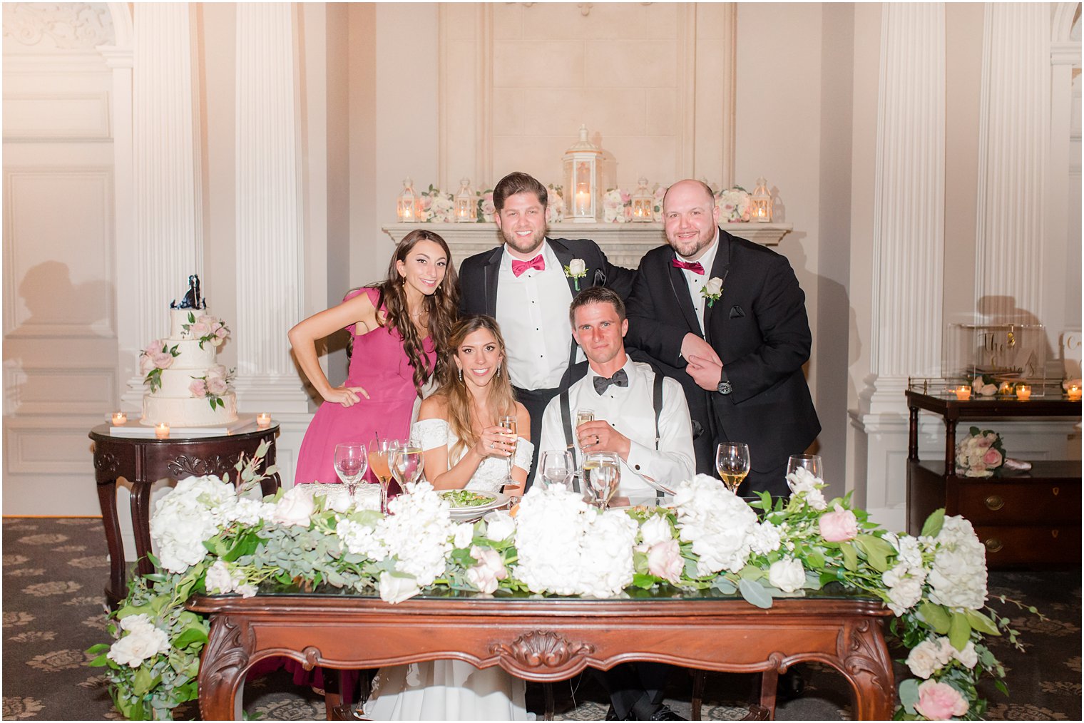 newlyweds pose with best man and maid of honor at Park Savoy Estate