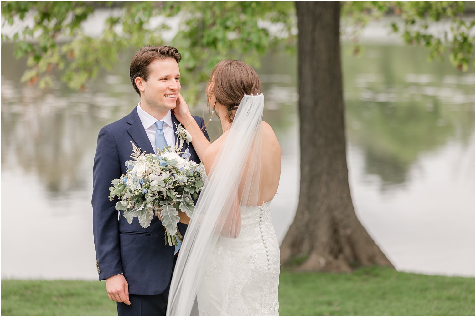 bride wipes tear off husband's face during first look