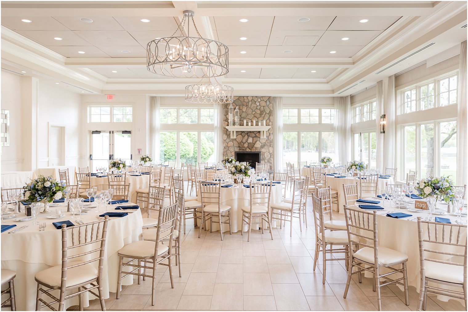 spring wedding reception with blue and white details at Indian Trail Club