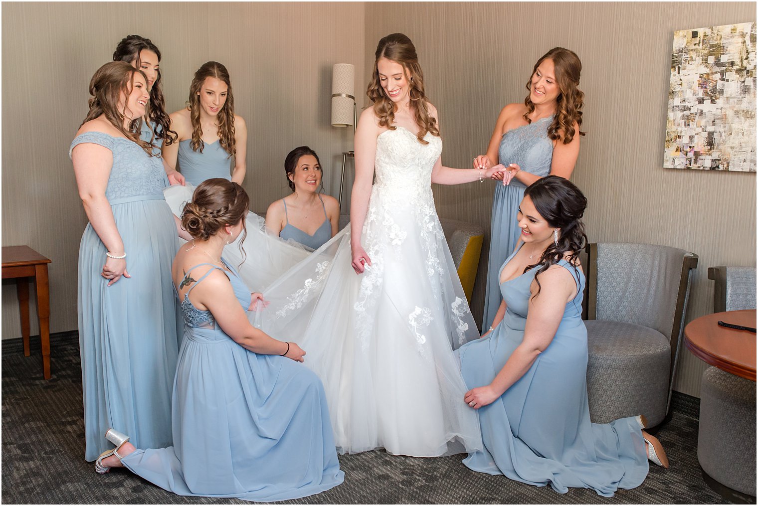 bride prepares for English Manor wedding with bridesmaids in blue gowns 
