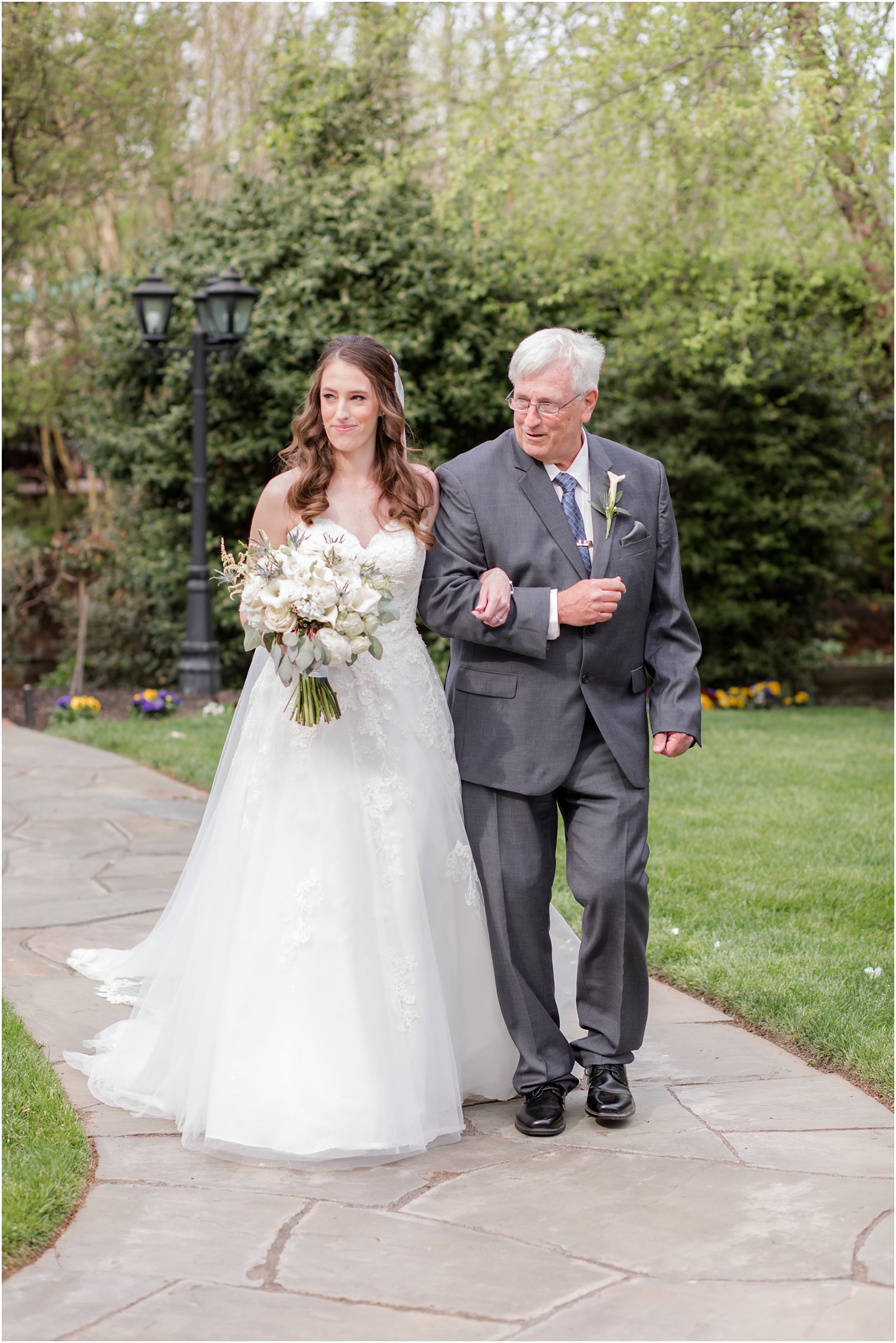 father walks bride into ceremony at The English Manor
