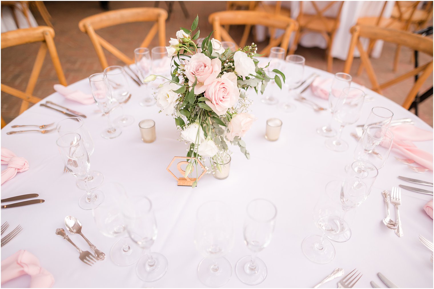 place setting with pink flowers at The Inn at Fernbrook Farms