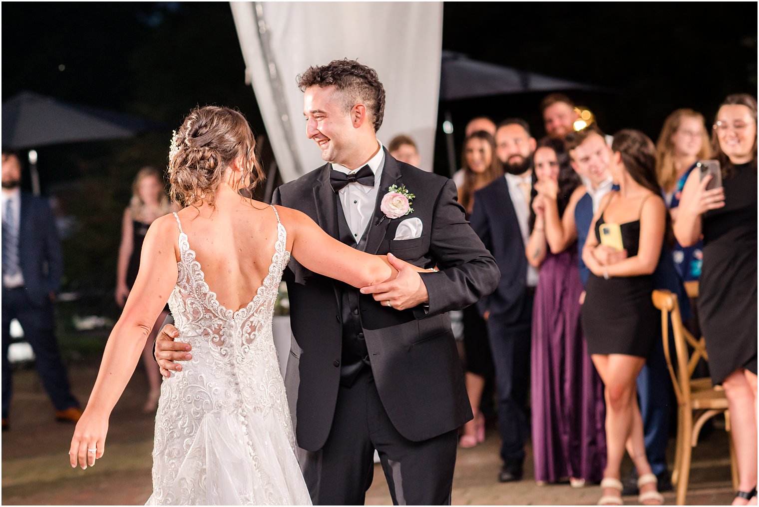 bride and groom dance in center of tent at The Inn at Fernbrook Farms