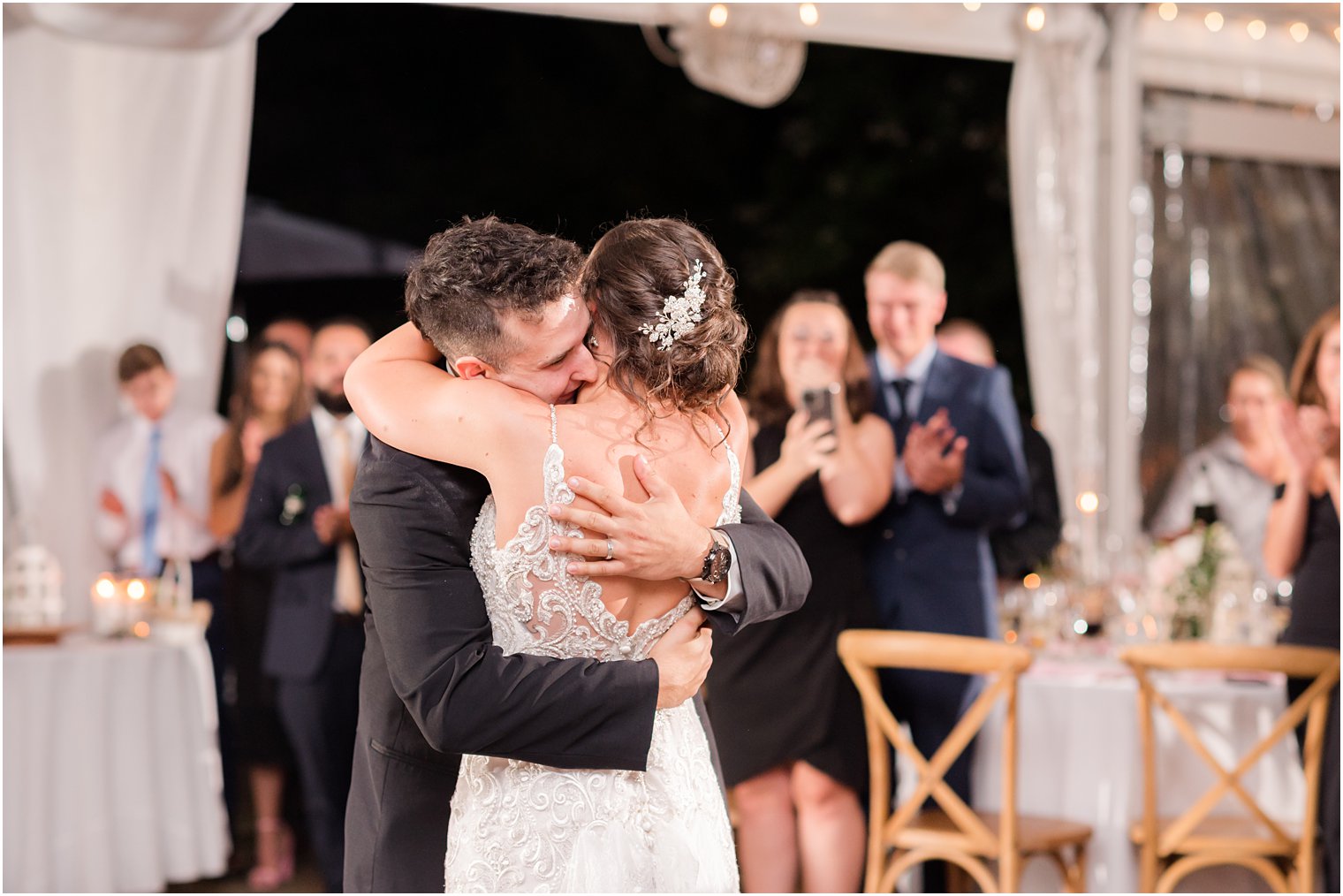bride and groom hug during NJ wedding reception 