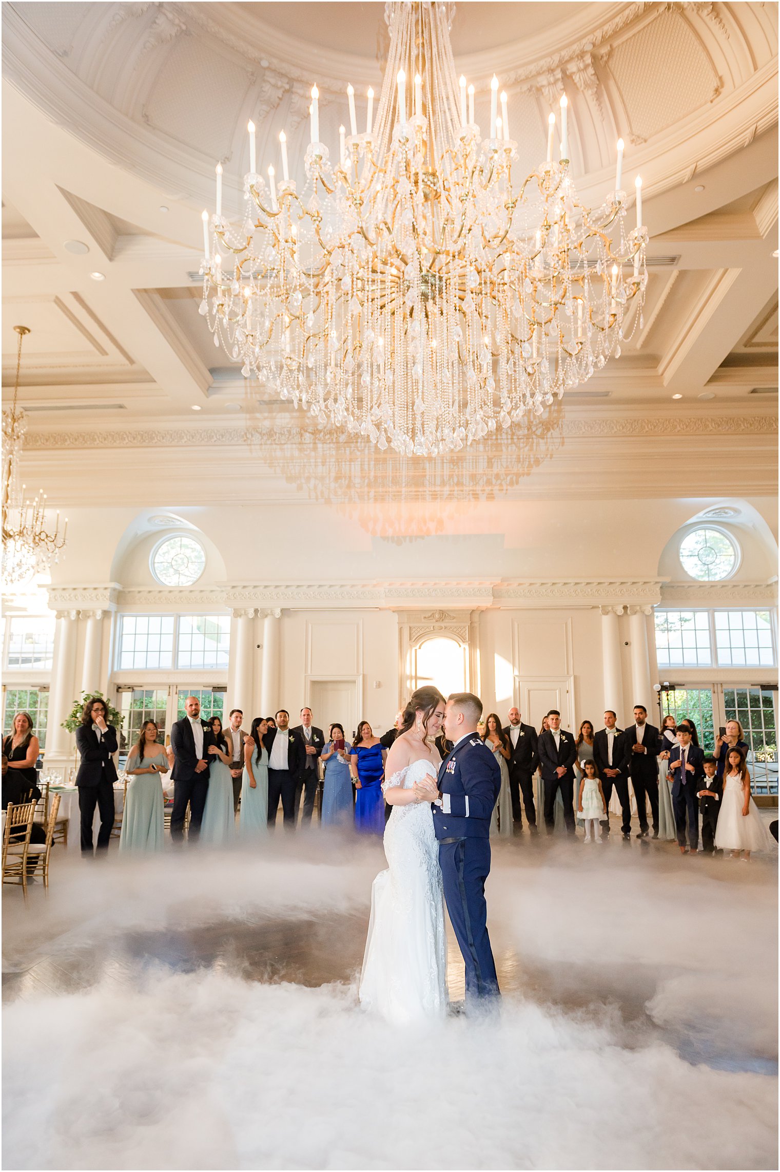 newlyweds dance in Park Chateau Estate ballroom with fog 
