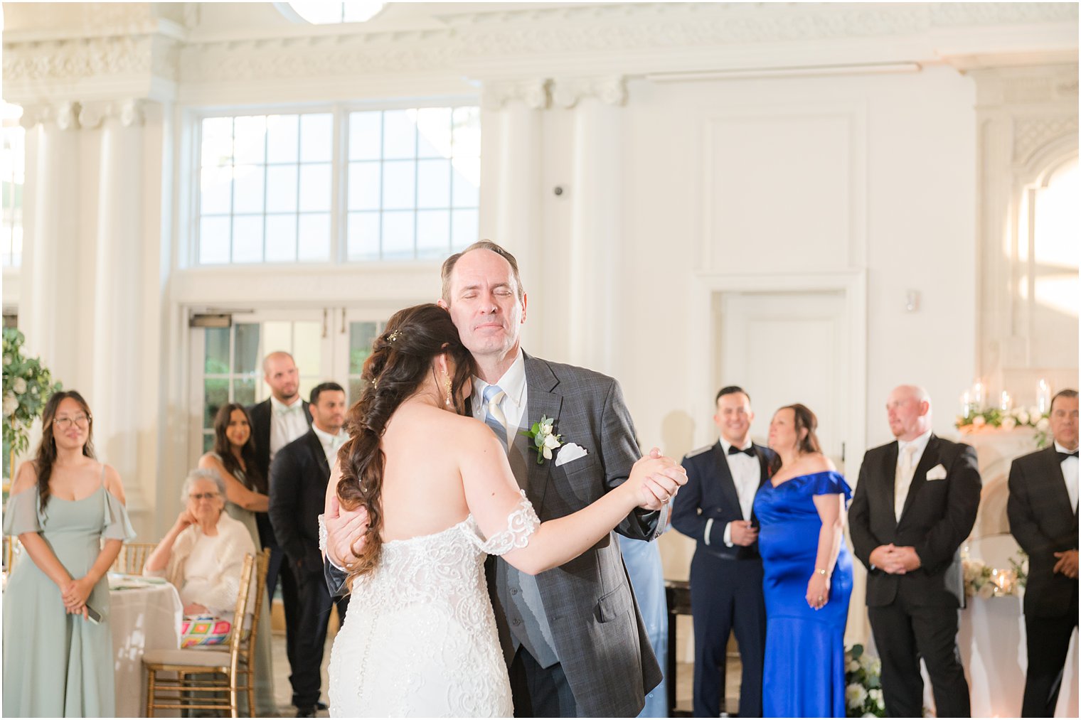 bride hugs dad during wedding reception in New Jersey 