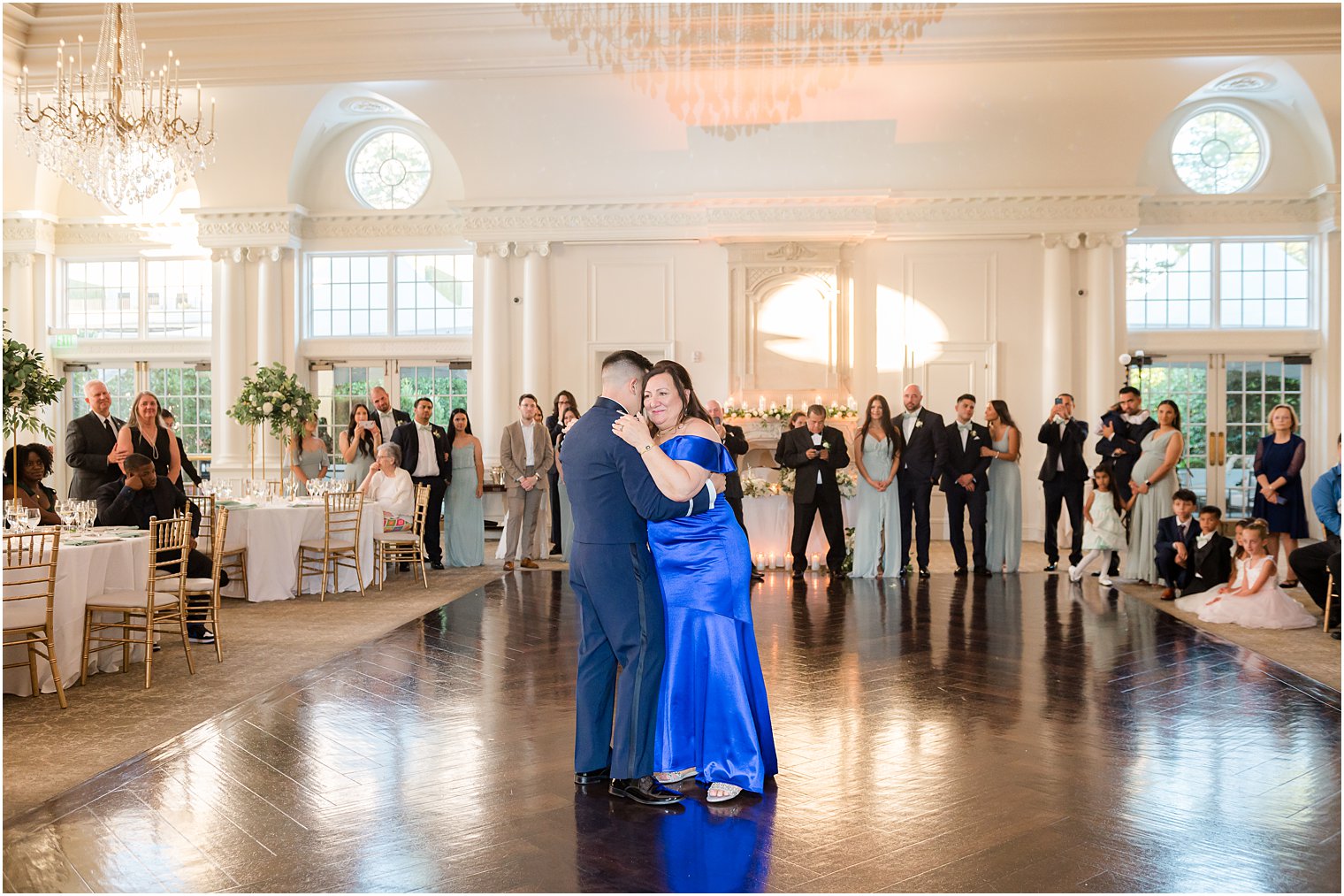 groom and mother dance in ballroom at Park Chateau Estate
