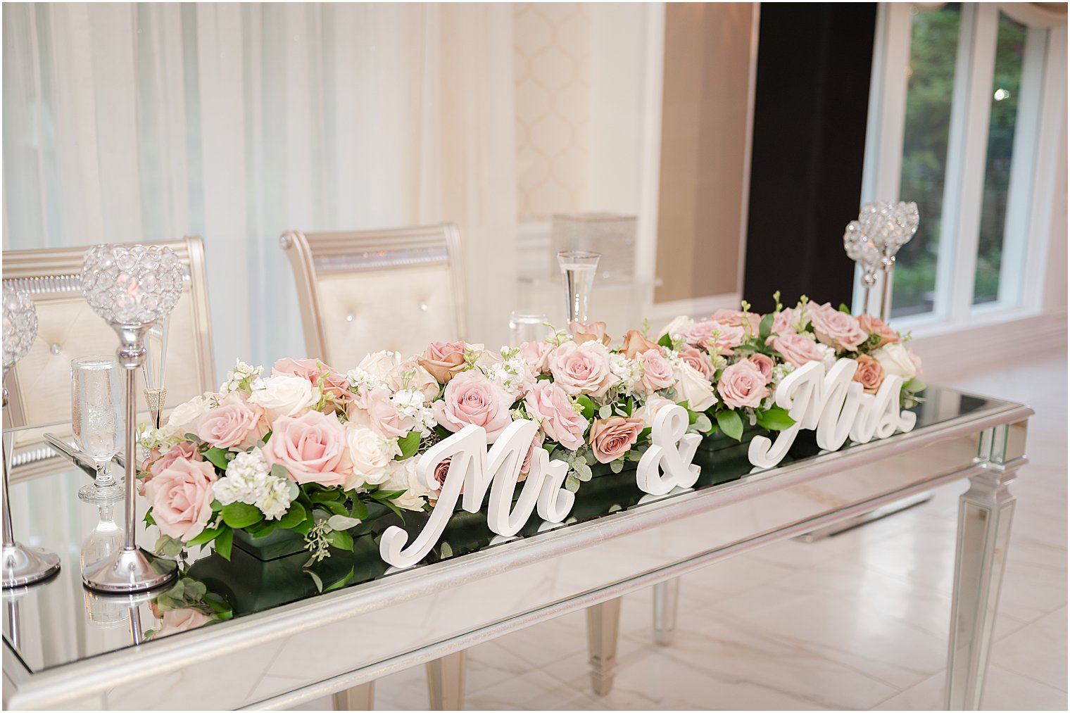 sweetheart table with pink and white flowers