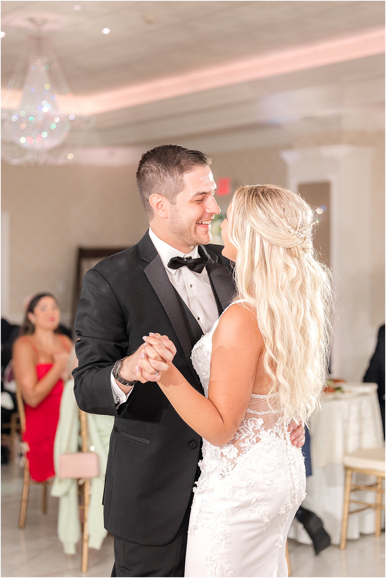 groom smiles at bride during first dance at The English Manor