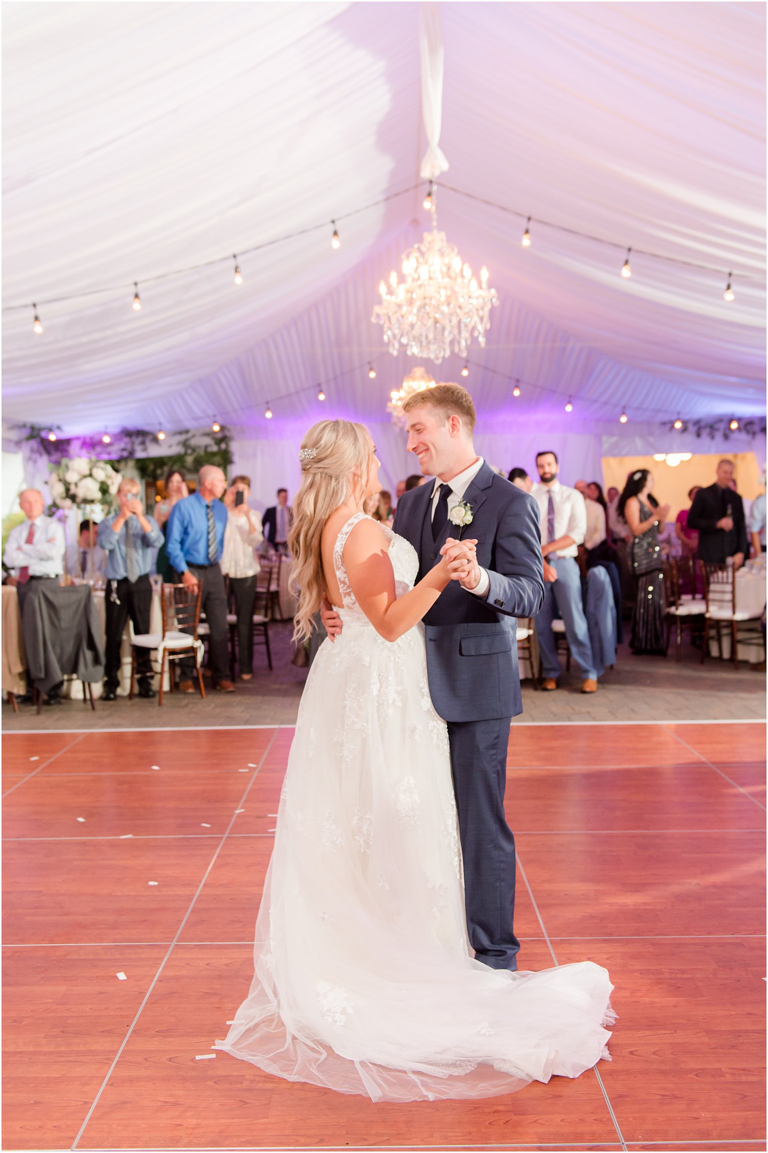 newlyweds dance under tent at Windows on the Water at Frogbridge