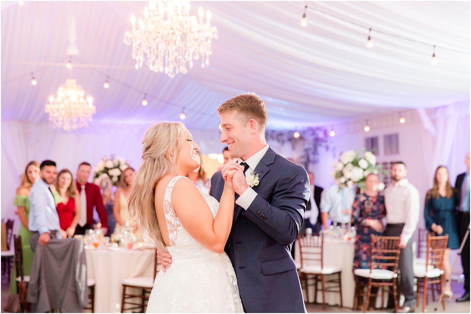 bride and groom dance under tent at Windows on the Water at Frogbridge