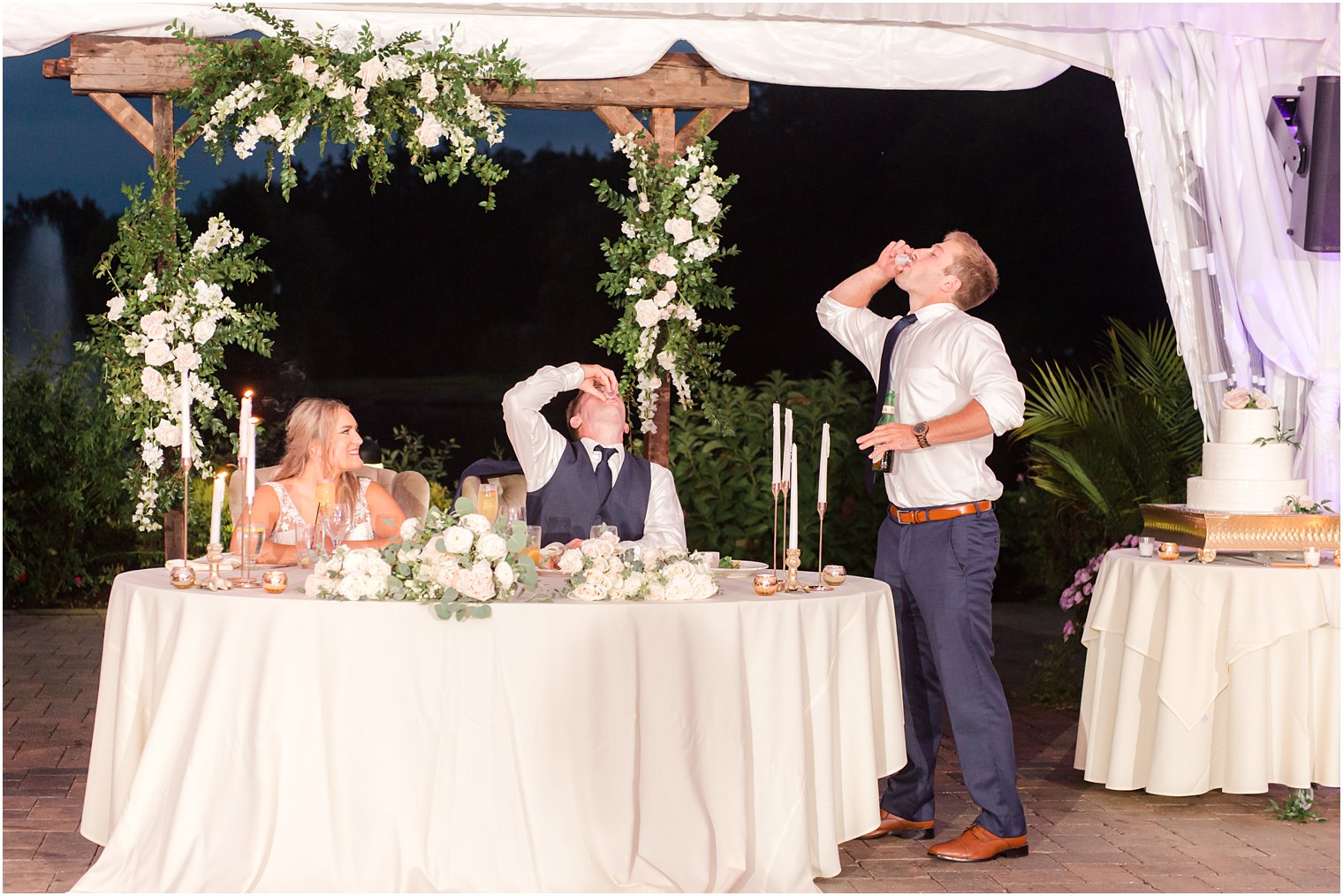 groom and groomsman do shots during toast