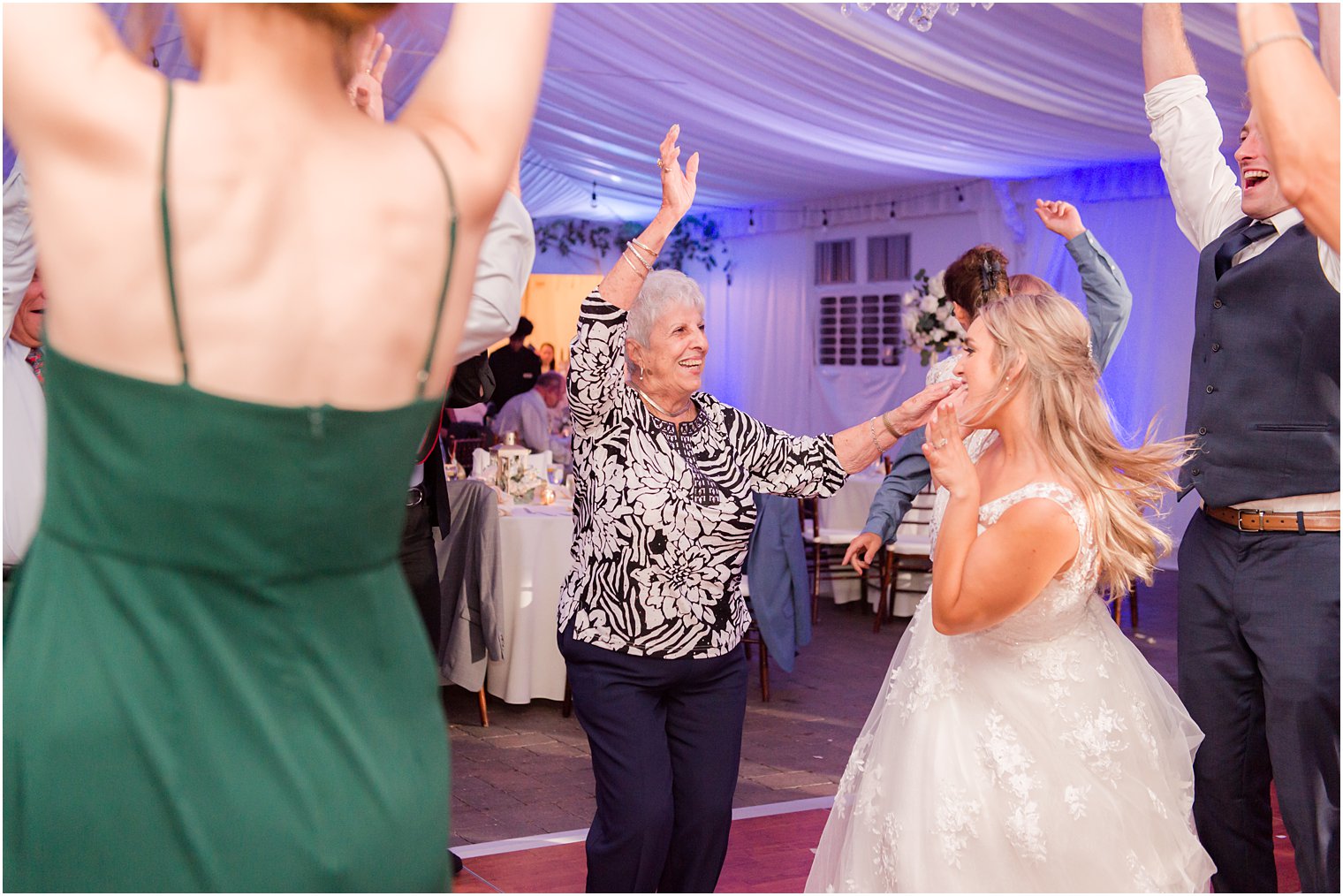bride and grandmother dance during wedding reception at Windows on the Water at Frogbridge