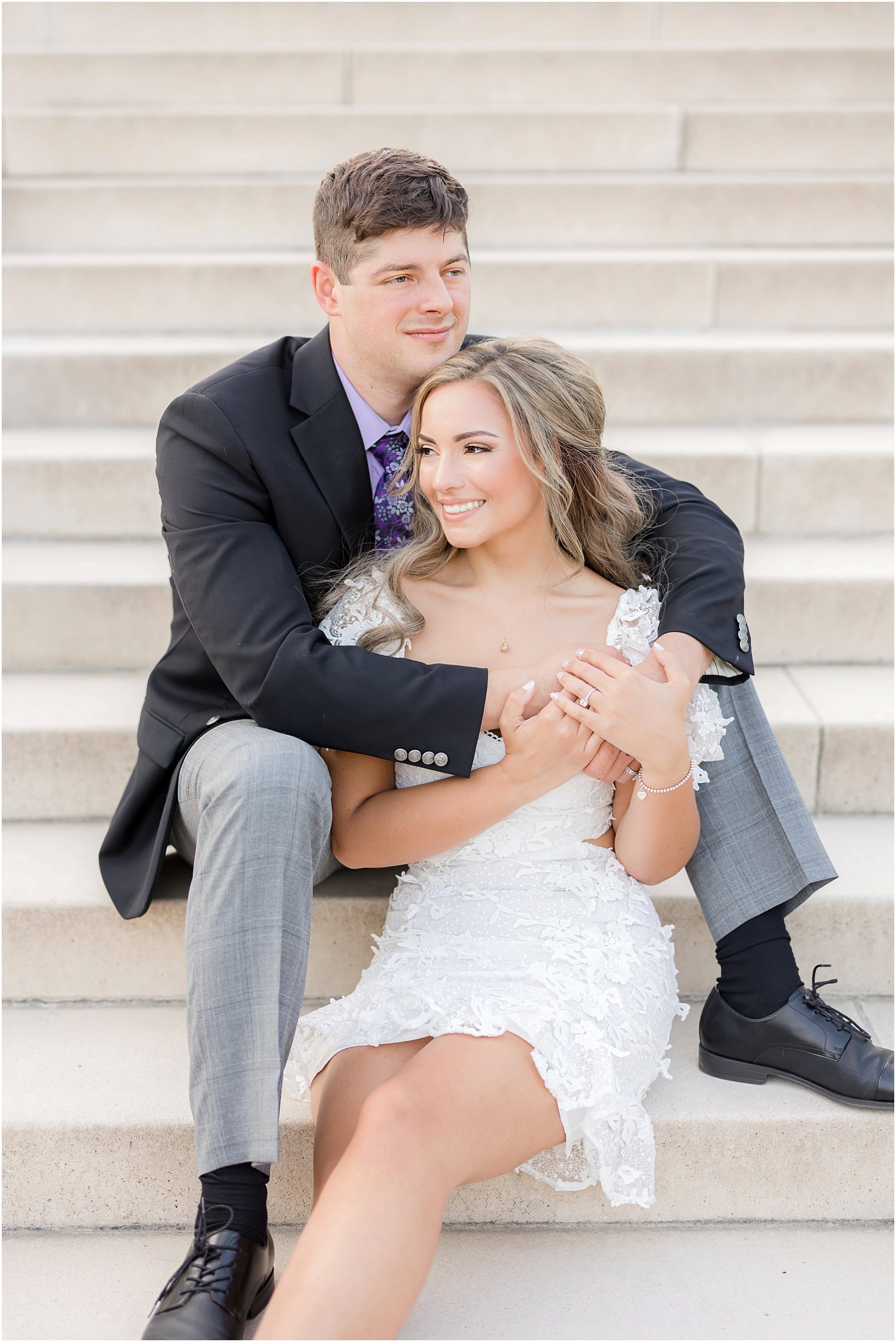 engaged couple sits on staircase during Longwood Gardens engagement session